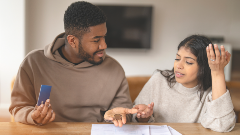 Couple working on their financial budget together.